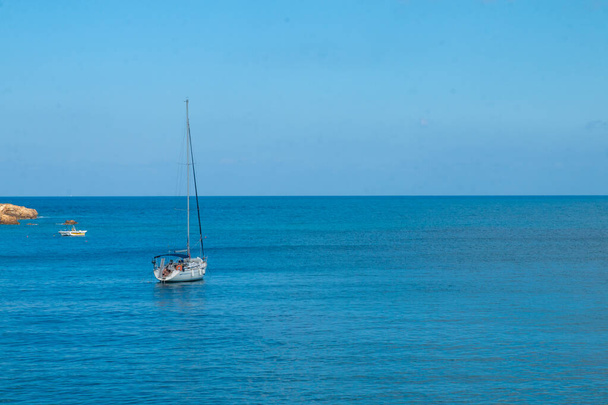Sailing yacht in the blue sea. Ship yacht sails in the open Sea. Luxury boats. Crete, Greece. Aegean sea. Copy Space. - Foto, afbeelding
