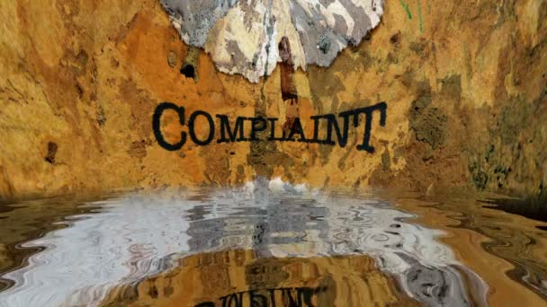 Complaint text on grunge background reflecting in water - Footage, Video