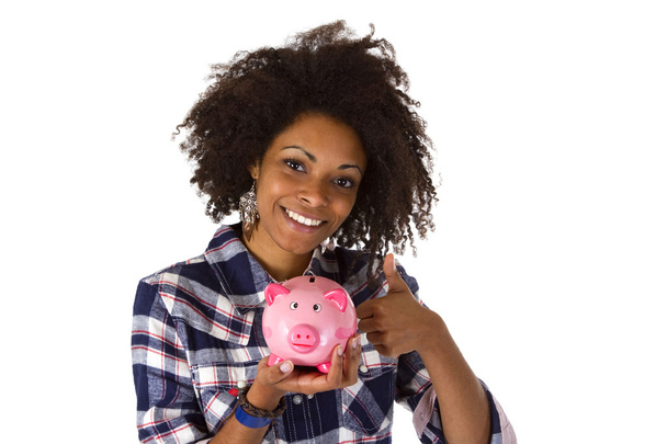 Young african american woman with piggy bank - Φωτογραφία, εικόνα