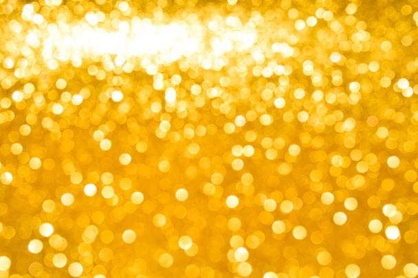 sparkles of golden glitter abstract background - Foto, afbeelding