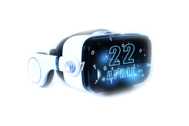22. dubna. 22. den v měsíci, kalendářní datum měsíc a den svítí na přilbě virtuální reality nebo Vr brýle. Virtuální technologie, budoucnost, 3D realita, virtuální kalendář. Plánování. Řízení času. Sada cal - Fotografie, Obrázek