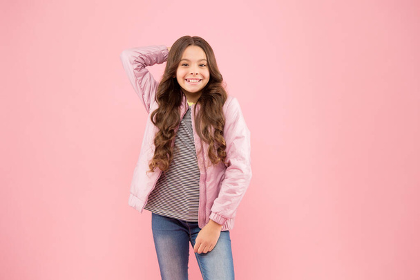 Fall trends. Autumn season collection. Street style outfit. Comfortable outfit for autumn. Trendy outfit. Little kid wear pink bomber jacket. Fashion girl. Modern fashion for kids. Clothes store - Fotó, kép