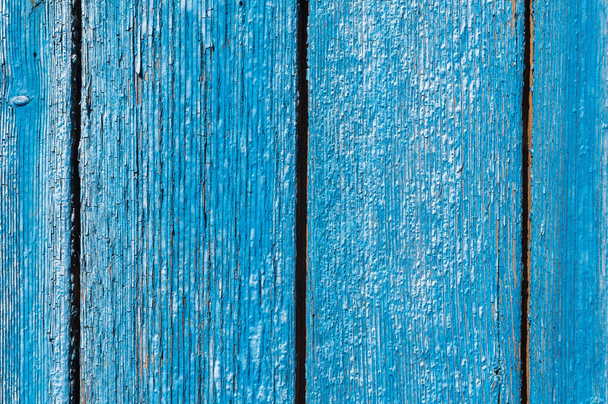 Old and peeling paint Over time, the blue paint peeled off from the old boards and the wood texture cracked. Vintage Abstract Grunge Background - Valokuva, kuva