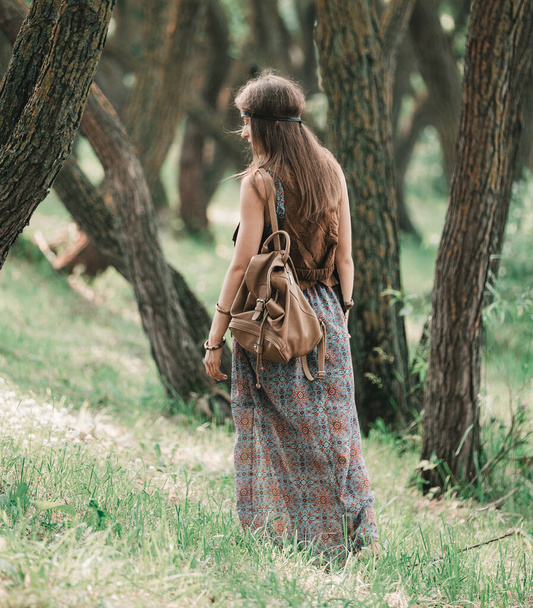 attractive hippie girl walking through the forest - 写真・画像