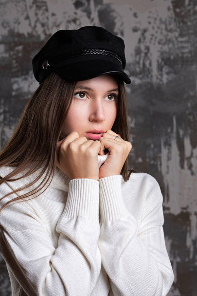 Stylish girl ears cap and knitted sweater  - Zdjęcie, obraz