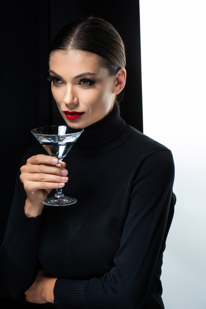 beautiful woman with red lips holding martini isolated on white and black - Fotografie, Obrázek