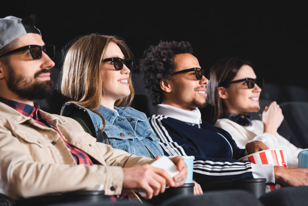 multicultural friends in 3d glasses smiling and watching movie in cinema  - Fotó, kép