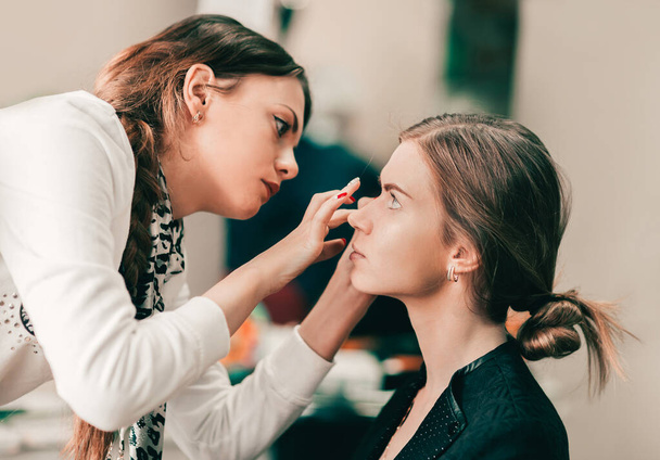 makeup artist preparing bride before the wedding in a morning - Photo, image