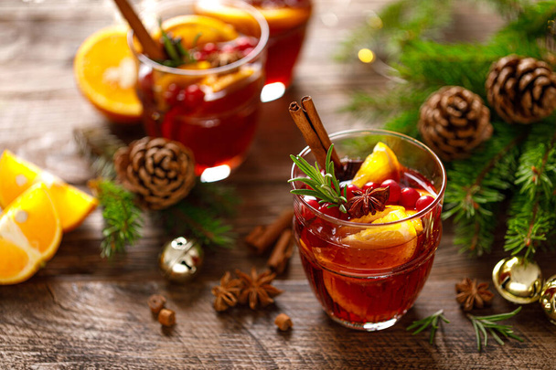 Christmas mulled wine. Traditional festive drink with decorations and fir tre - Fotó, kép