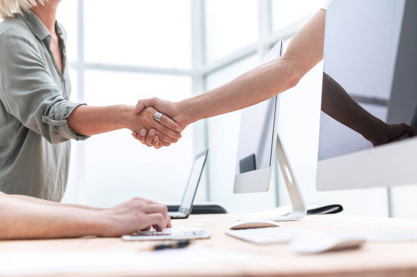 close up. business partners shake hands in the office. - Photo, image
