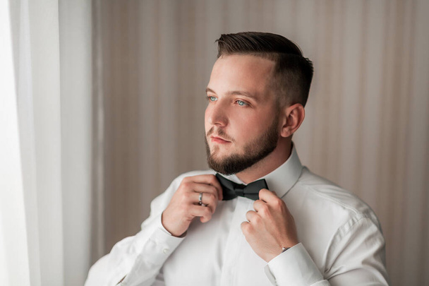 portrait of a handsome man with a bow tie - Foto, Imagem