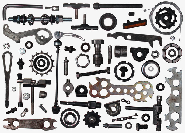 Old bicycle parts and tools in bike workshop - Fotó, kép