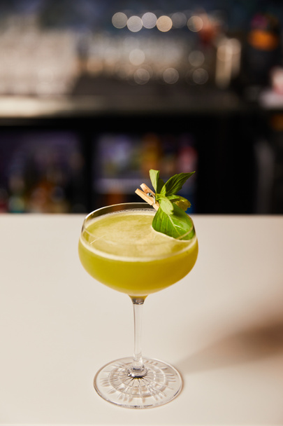 fresh alcohol cocktail in glass on bar counter  - Fotó, kép