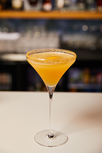 margarita glass with sweet cocktail on bar counter  - Fotó, kép