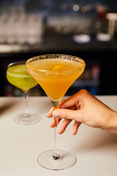 selective focus of woman touching cocktail in glass  - Photo, image