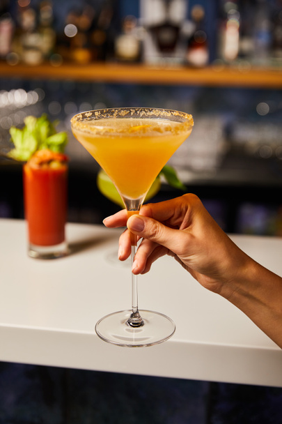 selective focus of woman holding margarita glass with cocktail - Photo, Image