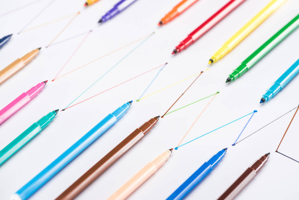 colorful felt-tip pens on white background with connected drawn lines, connection and communication concept - Photo, image