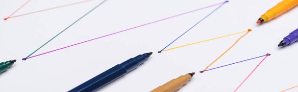 panoramic shot of colorful felt-tip pens on white background with connected drawn lines, connection and communication concept - Foto, immagini