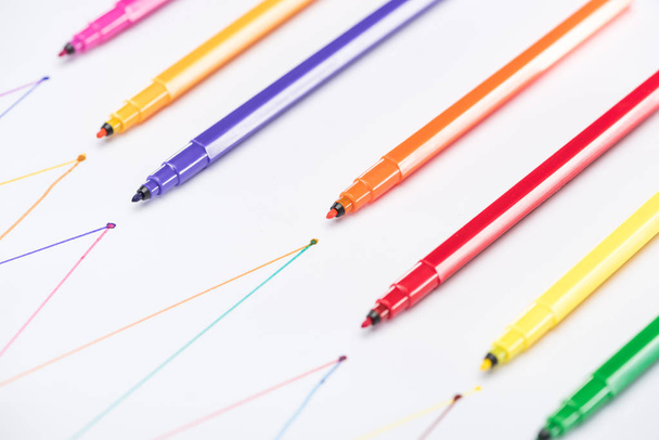 colorful felt-tip pens on white background with connected drawn lines, connection and communication concept - Photo, Image