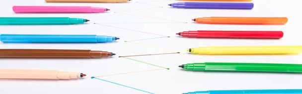 selective focus of felt-tip pens on white background with connected drawn lines, connection and communication concept - 写真・画像