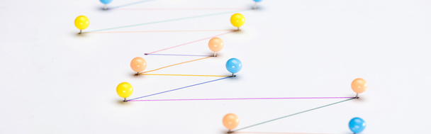 panoramic shot of colorful connected drawn lines with pins, connection and communication concept - Photo, Image