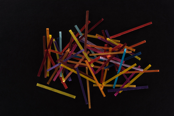 top view of multicolored abstract lines isolated on black background, connection and communication concept - Photo, Image