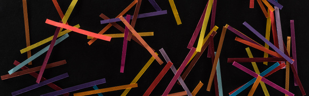 top view of multicolored abstract lines isolated on black background, connection and communication concept - Zdjęcie, obraz