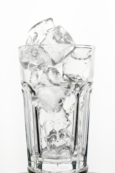Filling a glass with Ice showing a drink concept - Foto, imagen