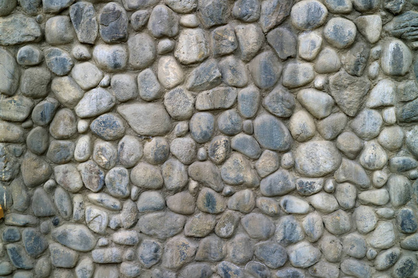 Szürke kerek kőfal textúra absztrakt háttér - Fotó, kép