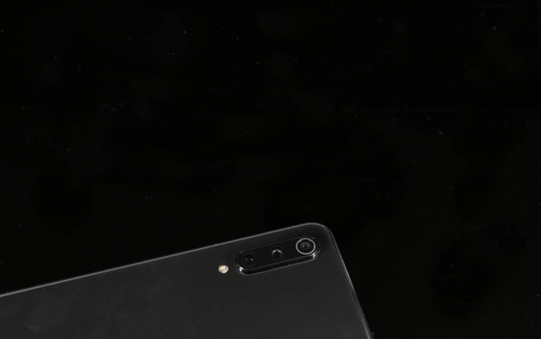 Closeup of mobile phone on black background  - Photo, Image