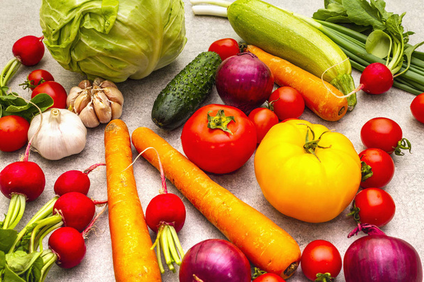 Assortment fresh organic vegetables. Food cooking stone background. Healthy vegetarian (vegan) eating concept, close up. - Фото, зображення