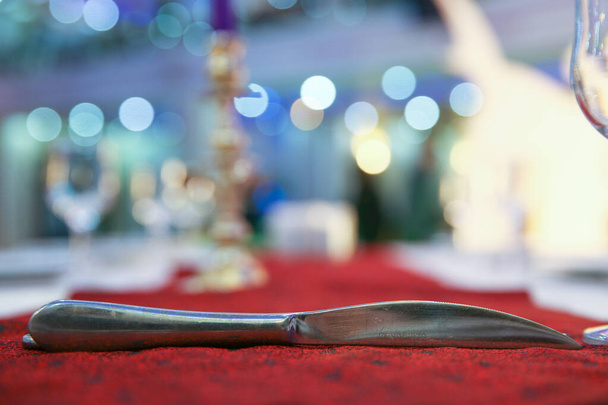 Kitchen utensils isolated on blurred background. Cutting sharp knife . knife blurred background in restaurant. - Foto, imagen