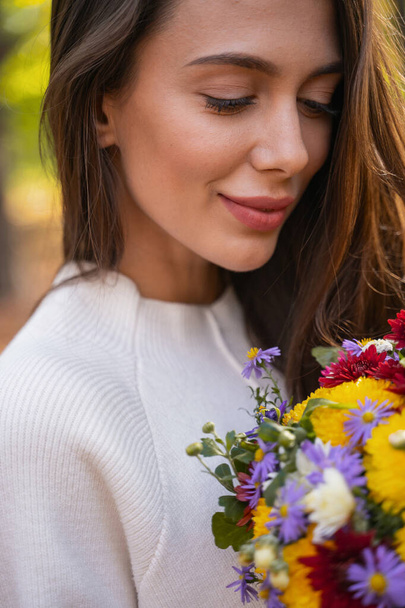 Beautiful lady being happy receiving bright flowers - Zdjęcie, obraz