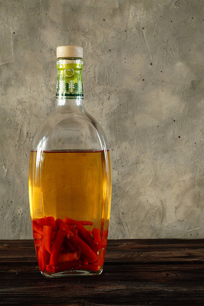 Medicinal tincture of pepper in a bottle. - Фото, зображення