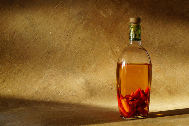 Medicinal tincture of pepper in a transparent bottle. - Zdjęcie, obraz