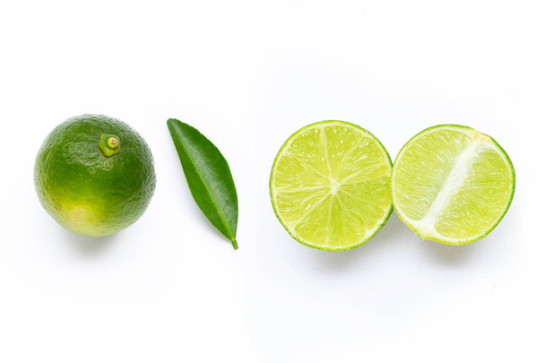 Fresh limes with leaf isolated on white  - Фото, изображение
