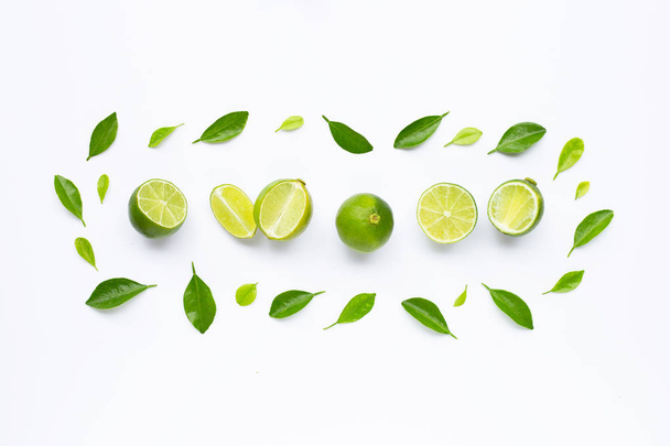 Limes with leaves isolated on white background. - Photo, image