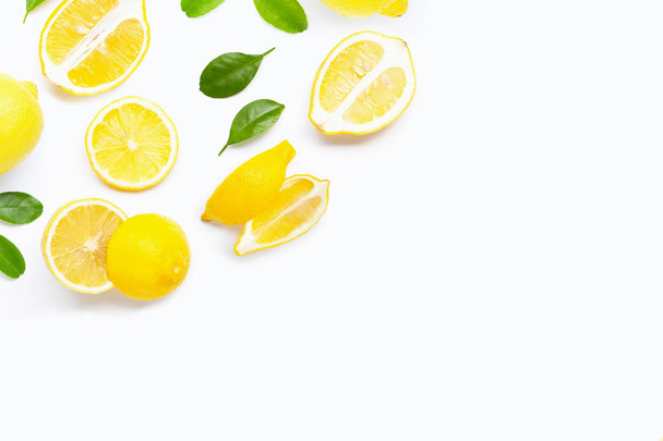 Fresh lemon with green leaves on white.  - Fotografie, Obrázek