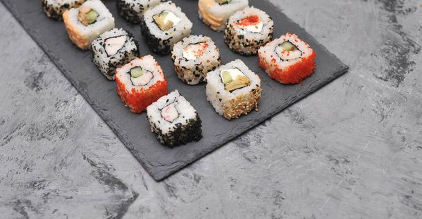 Japanese rolls on stone background. - Photo, Image