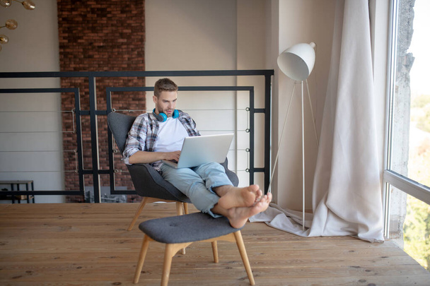 Young handsome successful businessman working from home - 写真・画像