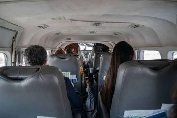 Behind the pilot room control in the small private jet plane in  - Photo, Image
