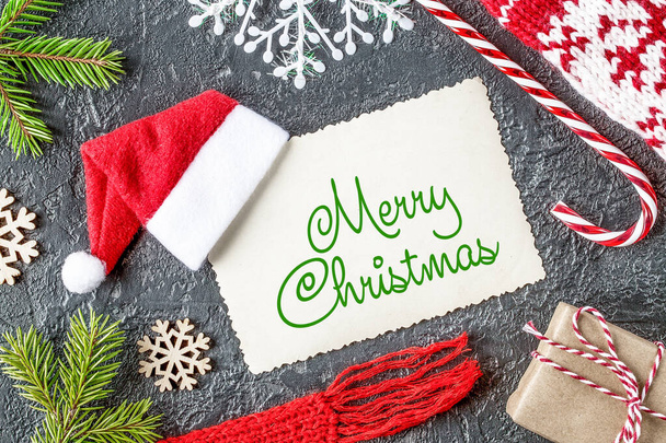 Creative Christmas card mockup with Santa Claus hat. - Foto, Imagen
