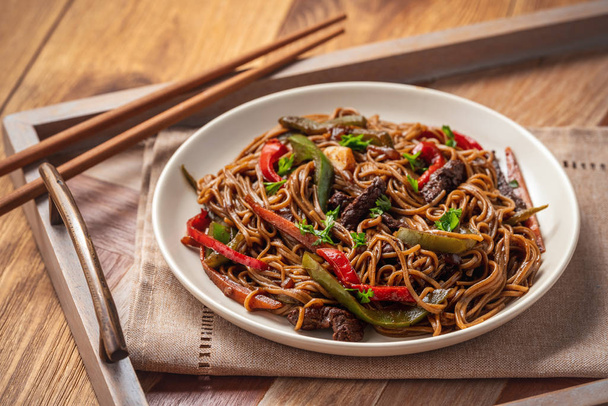 Soba noodles with vegetables and beef, asian style cuisine. - Photo, Image