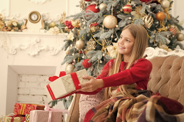Happy new year. Little girl with gift box. Happy child celebrate christmas and new year. Child girl prepare for boxing day holiday. Boxing day is the day after xmas. Christmas is about a big present - Фото, зображення