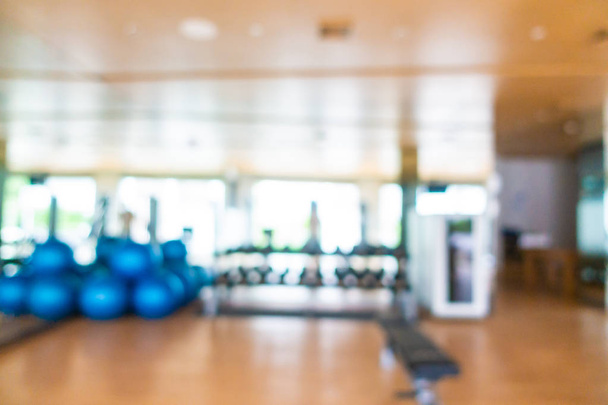 Abstract blur and defocus fitness equipment in gym interior - Photo, Image