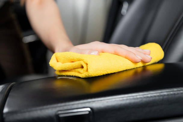 Car wash service, girl worker cleaning interior modern microfiber and console auto - Φωτογραφία, εικόνα