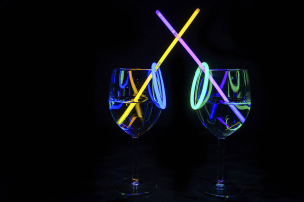 Cocktail wine glass filled with illuminated refreshing juicy liq - Photo, Image