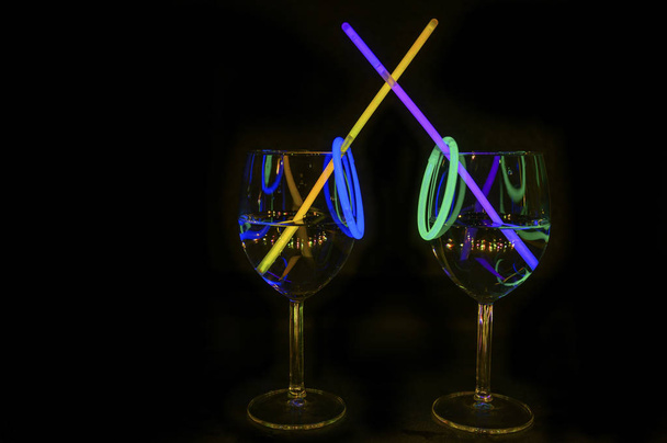 Cocktail wine glass filled with exotic illuminated refreshing al - Photo, Image