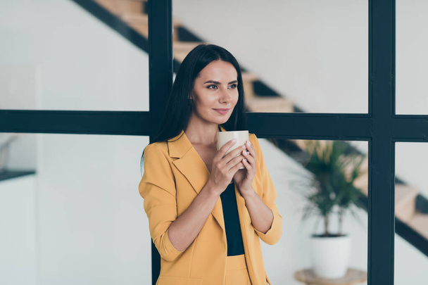 Portrait of her she nice attractive charming cute lovely cheery lady drinking hot cacao latte fresh start day in modern style light white glass interior apartment indoors - Foto, immagini