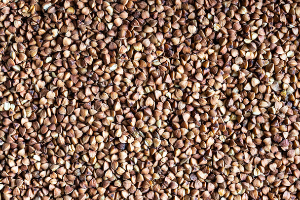Buckwheat background. Healthy vegeterian food. Grain texture. - Fotó, kép